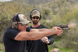 shooting-instructor-student-firing-glock-surefire-x300